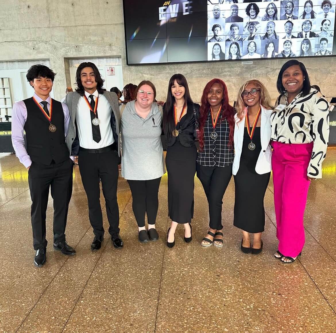 Students pose together at an Education is Freedom awards banquet