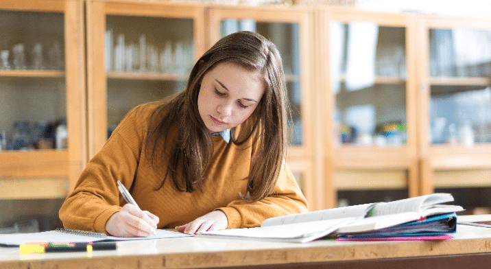Female Student Studying in Class